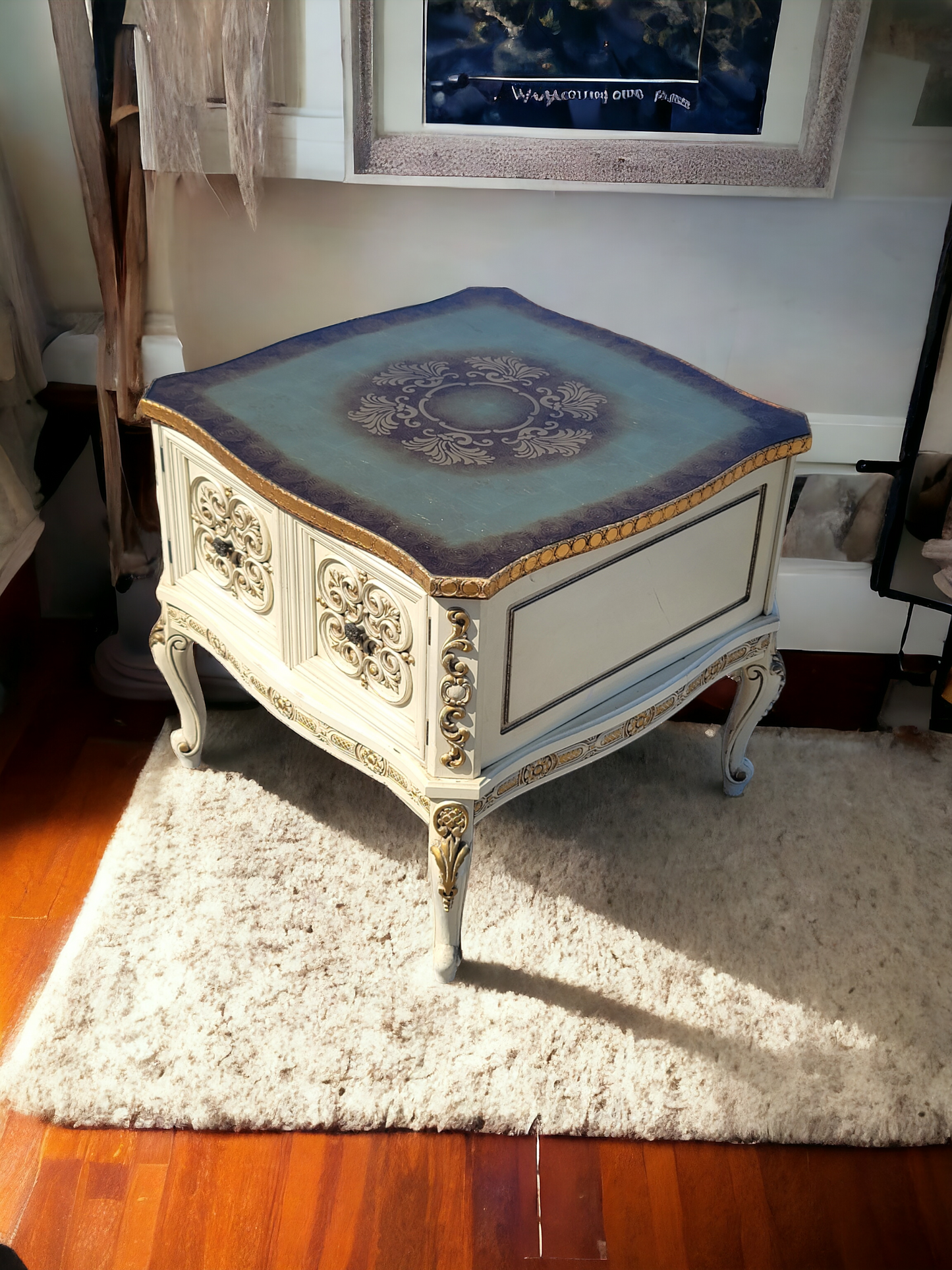 Italian coffee table with carved details and gold leaf decoration.