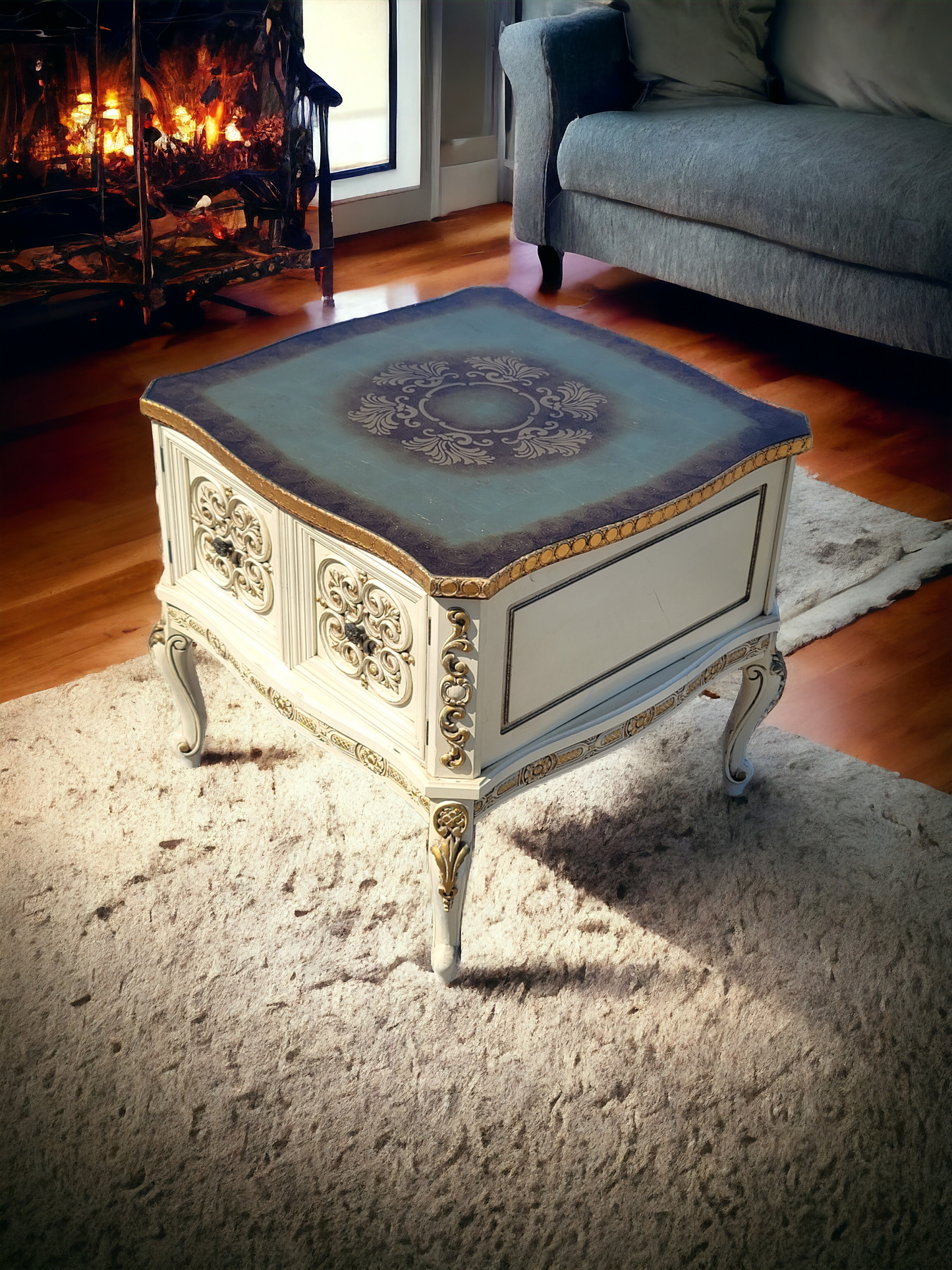 Italian coffee table with carved details and gold leaf decoration.