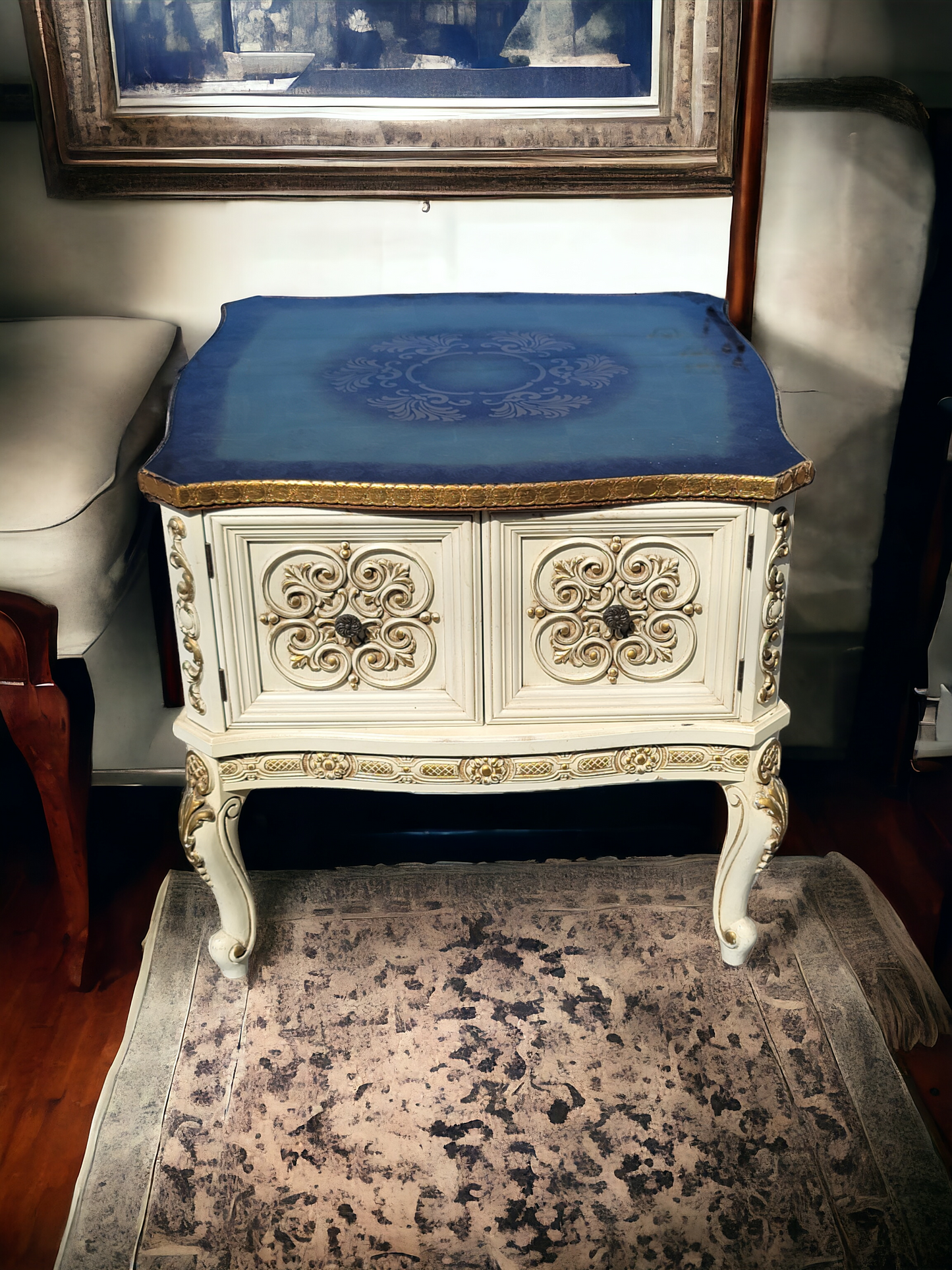 Italian coffee table with carved details and gold leaf decoration.