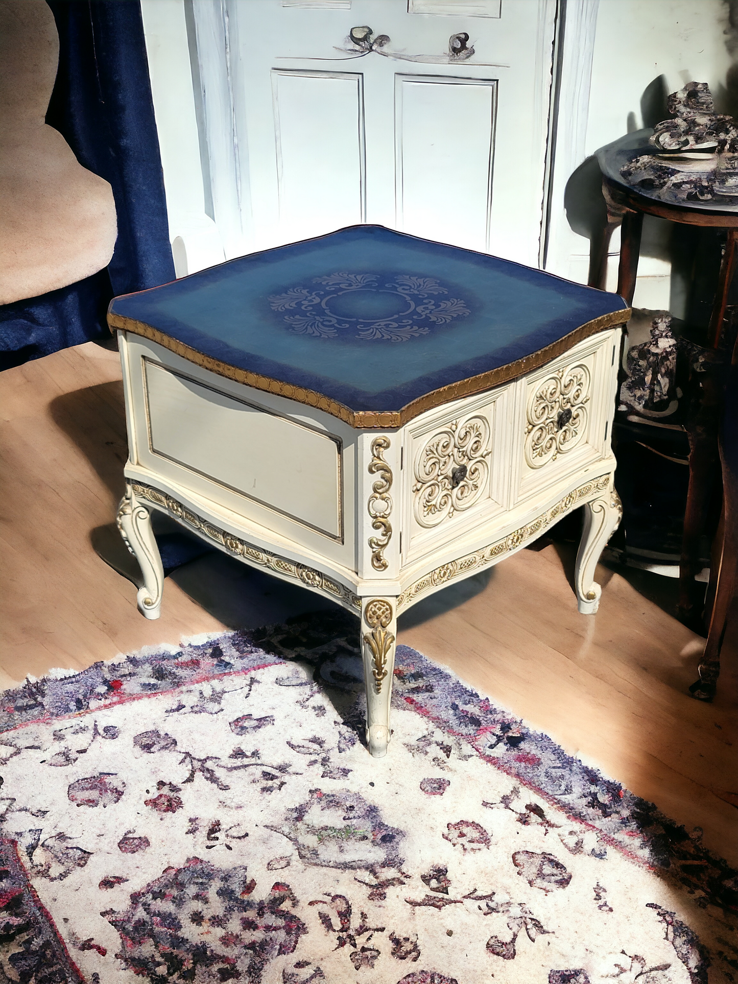 Italian coffee table with carved details and gold leaf decoration.